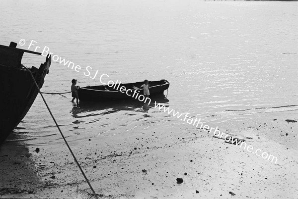 CHILD AT ROWING BOAT